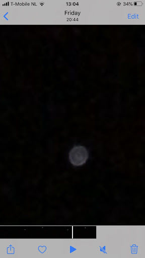 Rond licht punt veel snel naar boven gaat dan uit foto