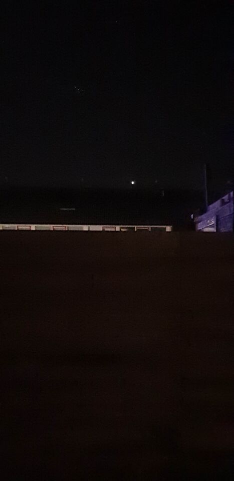 A bright orb: appeared to be spinning, had what appeared to be red lights foto