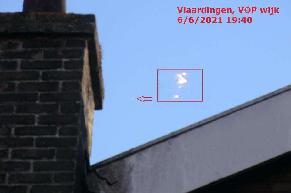 Zwerm objecten, horizontaal verplaatsend, zonlicht weerkaatsend. Vlaardingen ZH foto