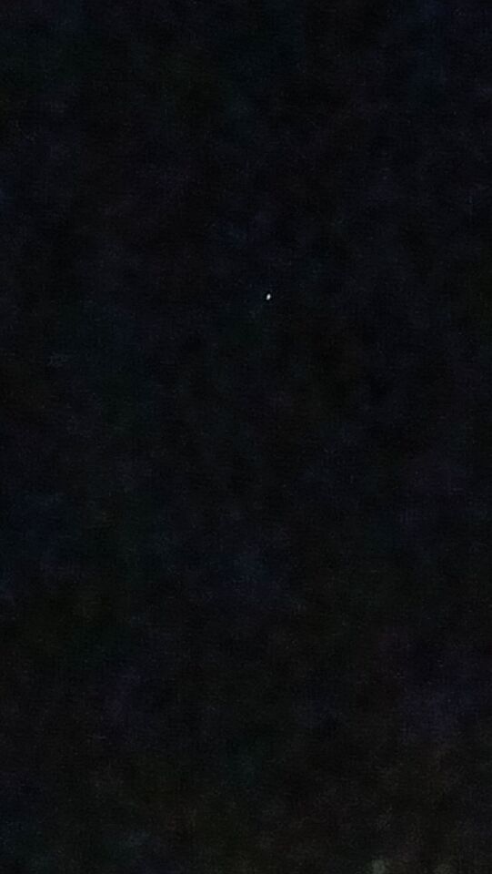 Drie flikkerende witte lichtpuntjes foto