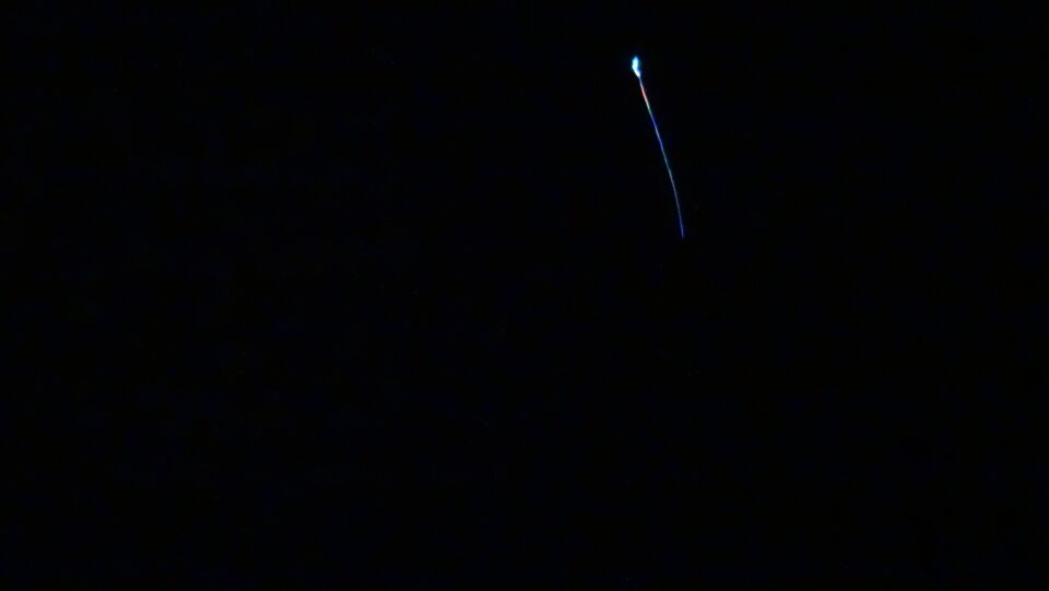 Gekleurde lichtstreep met wit lichtbal (leaser ?) foto