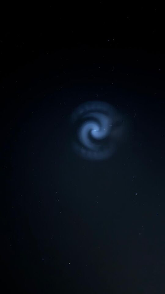 Vlindervormige lichtpunt dat in een spiraalvorm veranderde foto