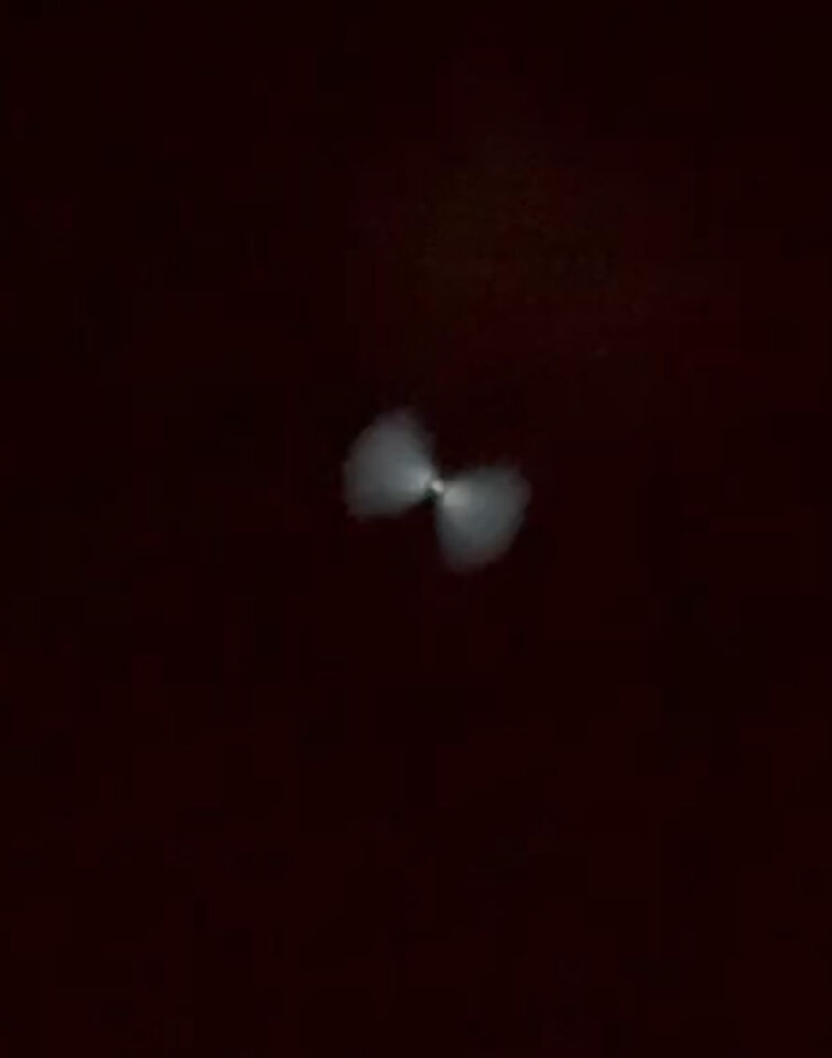 Vlindervormige lichtpunt dat in een spiraalvorm veranderde foto