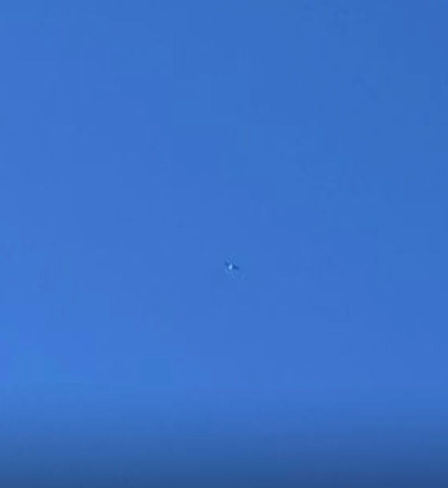 Glimmend object dat in een boog vloog foto