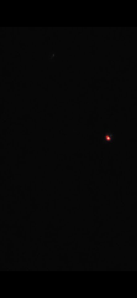 Bewegende rood gele witte lichtjes boven teteringen foto
