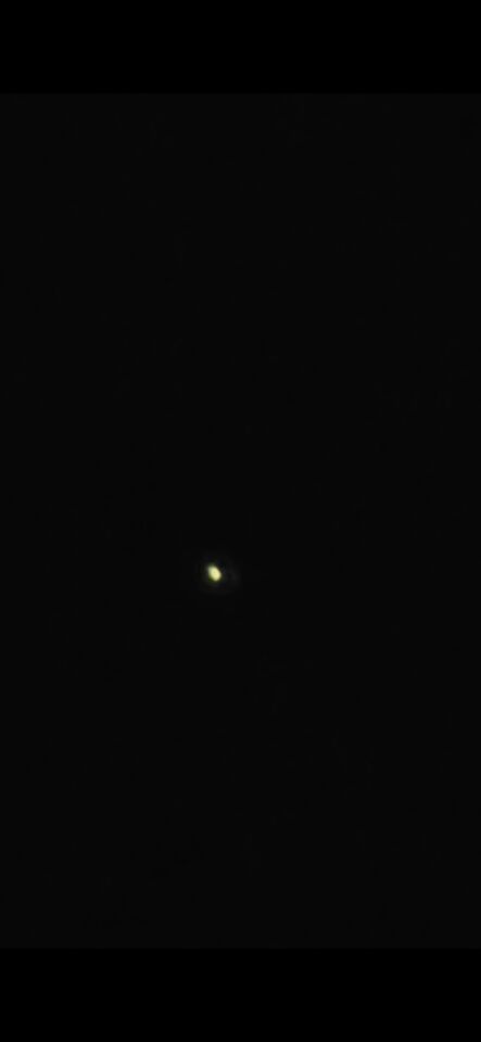 Bewegende rood gele witte lichtjes boven teteringen foto