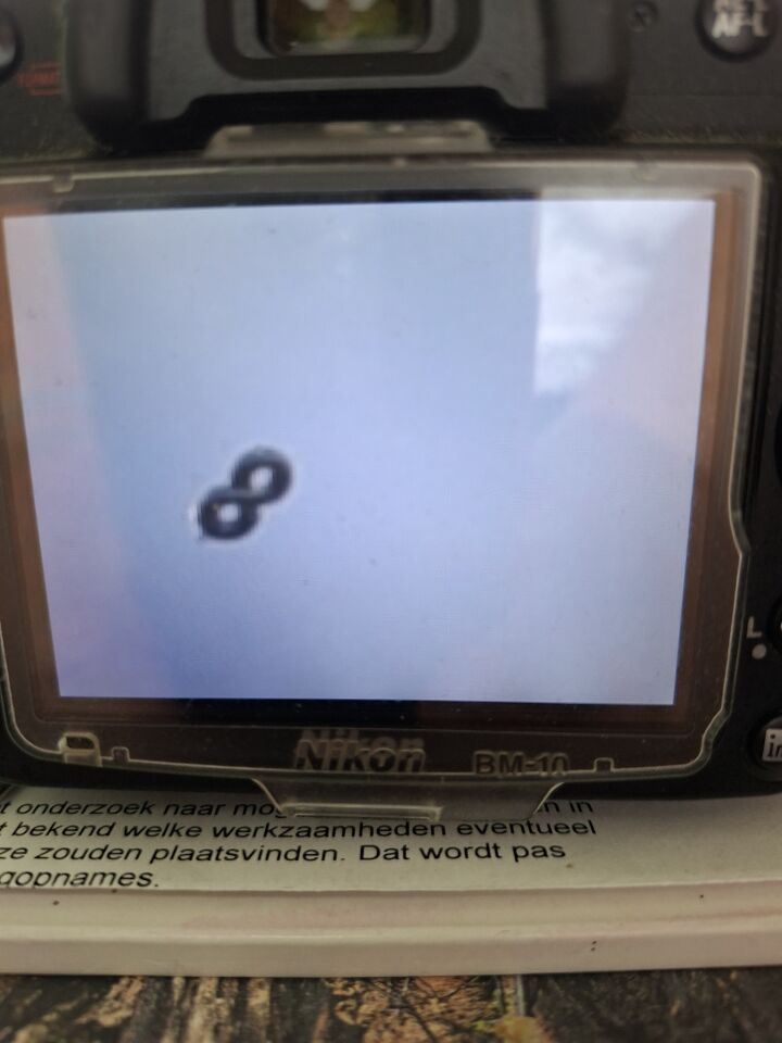 Zwart lemniscaat 2 lichtere puntjes foto