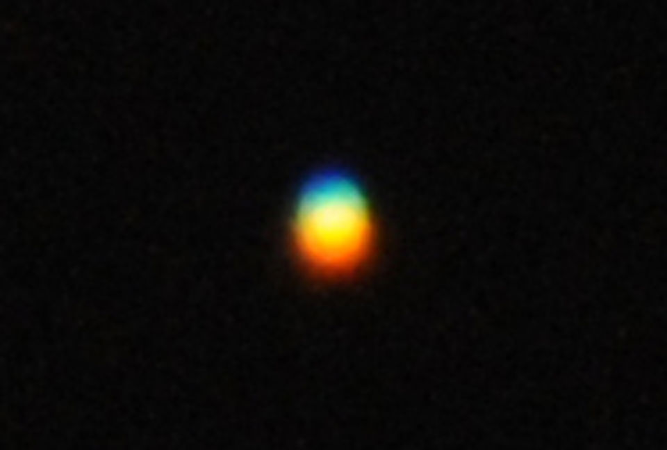 Langzaam vliegende kleurrijke orb boven Rijssen foto