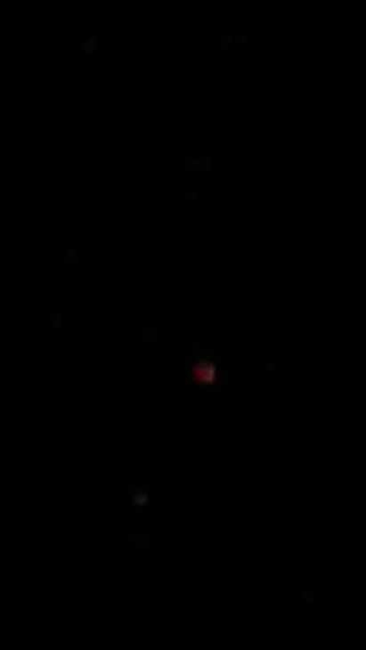 Roterende/pulserende, felle, van kleur veranderende lichtbol, 2e waarneming foto